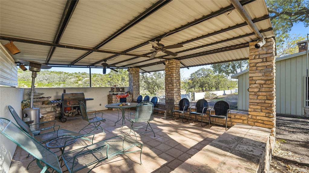 Undisclosed Address Del Rio, TX 78840 - Photo 37 of 40 a living room with patio furniture and a floor to ceiling window