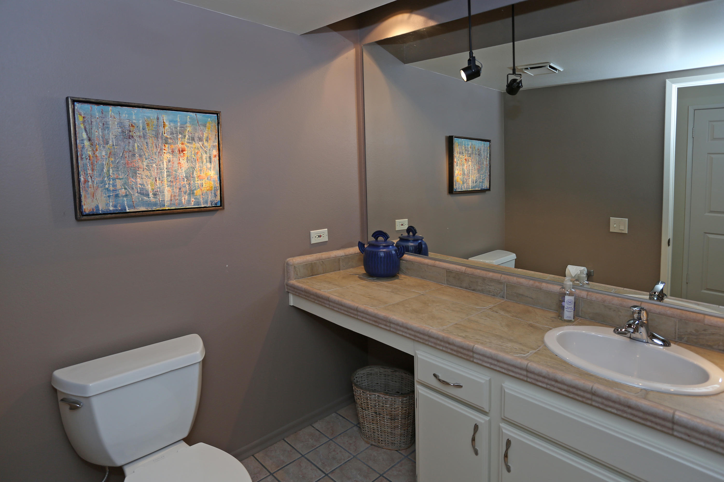 3881 Nathan Road Santa Barbara, CA 93110 - Photo 9 of 12 a bathroom with a toilet sink and mirror