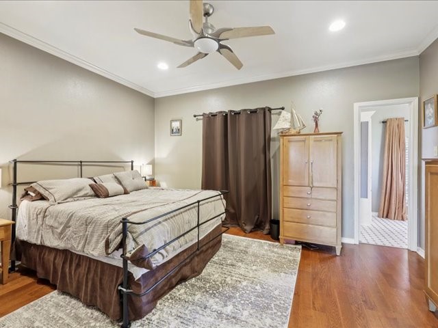 2700 Spurlock Road Nederland, TX 77627 - Photo 12 of 44 a bedroom with a bed dresser and a walk in closet