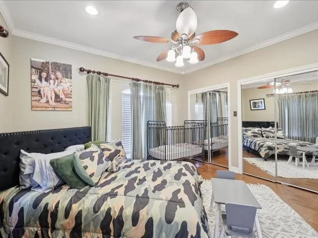 a bed room with a bed and a chandelier