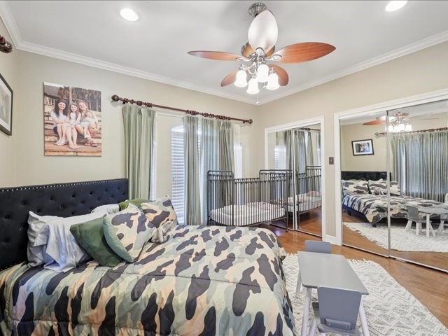 2700 Spurlock Road Nederland, TX 77627 - Photo 13 of 44 a bed room with a bed and a chandelier
