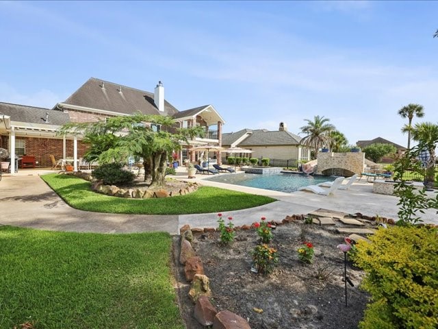 2700 Spurlock Road Nederland, TX 77627 - Photo 2 of 44 a view of a house with a yard