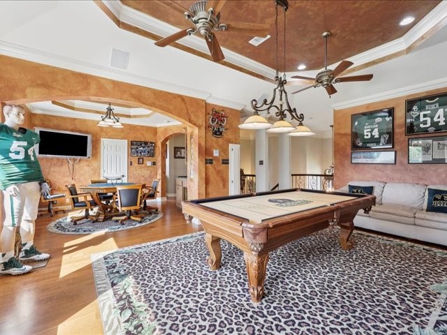 2700 Spurlock Road Nederland, TX 77627 - Photo 22 of 44 a living room with furniture a chandelier and a flat screen tv