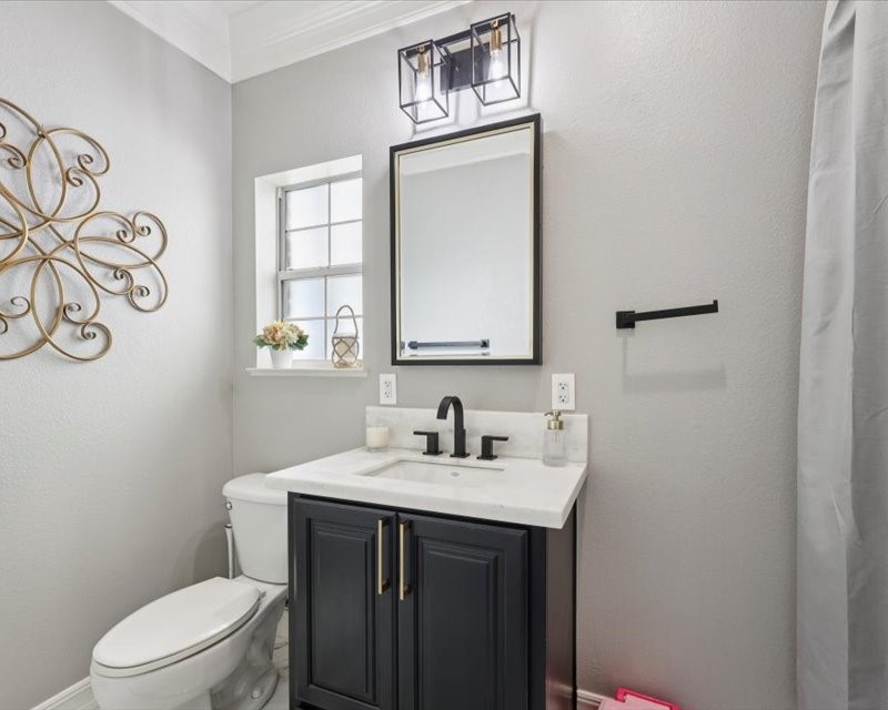 2700 Spurlock Road Nederland, TX 77627 - Photo 24 of 44 a bathroom with a sink vanity mirror and toilet