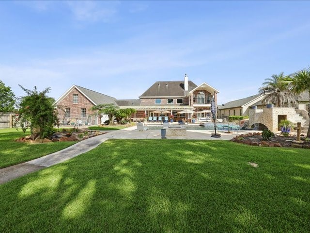 2700 Spurlock Road Nederland, TX 77627 - Photo 36 of 44 a view of a big house with a big yard and large trees