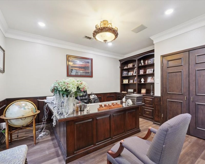 2700 Spurlock Road Nederland, TX 77627 - Photo 37 of 44 a kitchen with stainless steel appliances granite countertop a stove a chimney a sink and cabinets