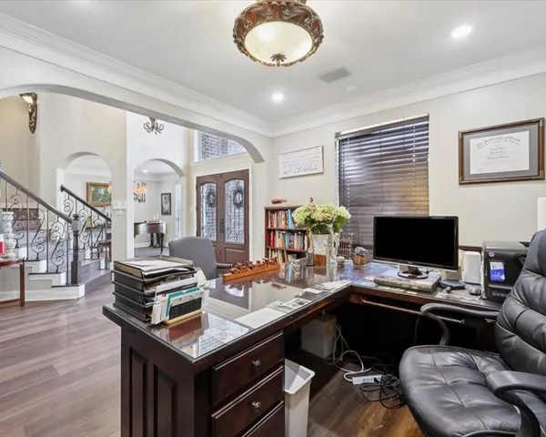 a workspace with furniture and wooden floor