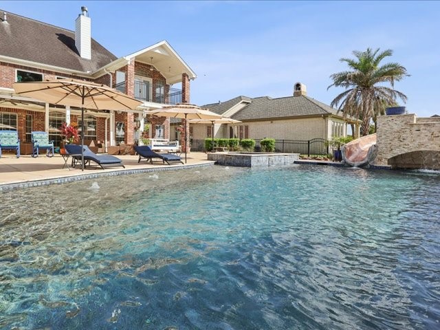 2700 Spurlock Road Nederland, TX 77627 - Photo 41 of 44 a view of a town with lawn chairs under an umbrella