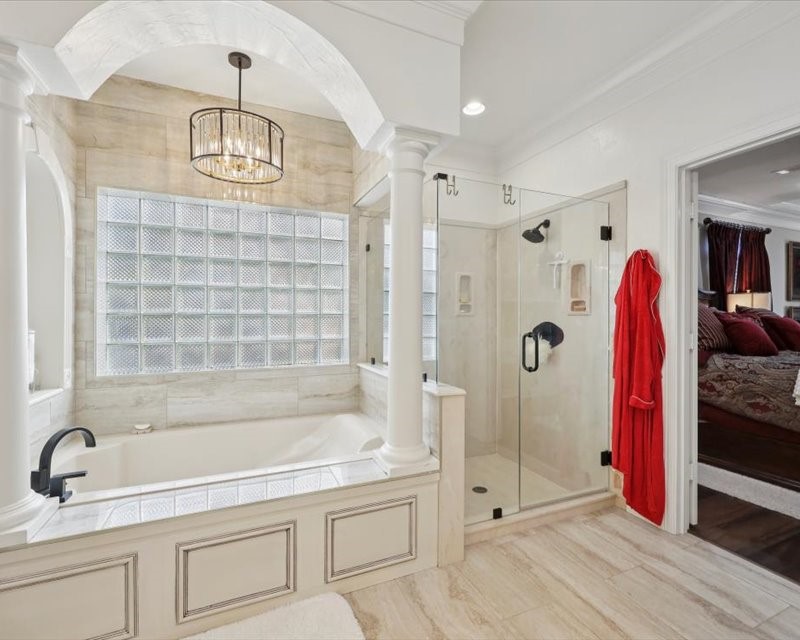 2700 Spurlock Road Nederland, TX 77627 - Photo 7 of 44 a bathroom with a tub and a shower