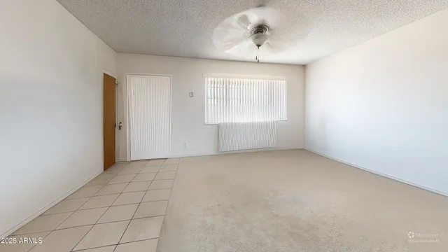 an empty room with a empty space and windows