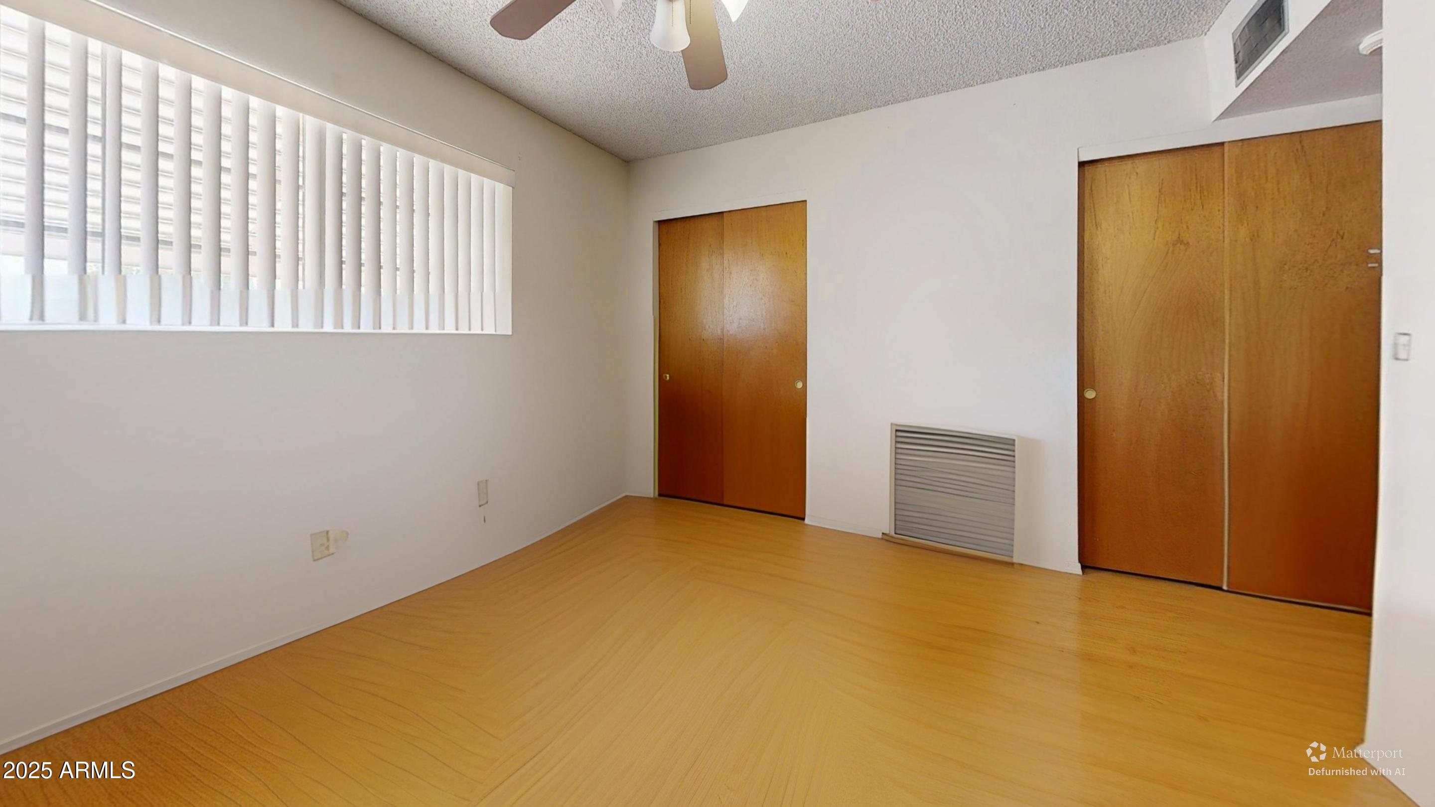 1432 South Lawther Drive Apache Junction, AZ 85120 - Photo 24 of 29 a view of an empty room with a window
