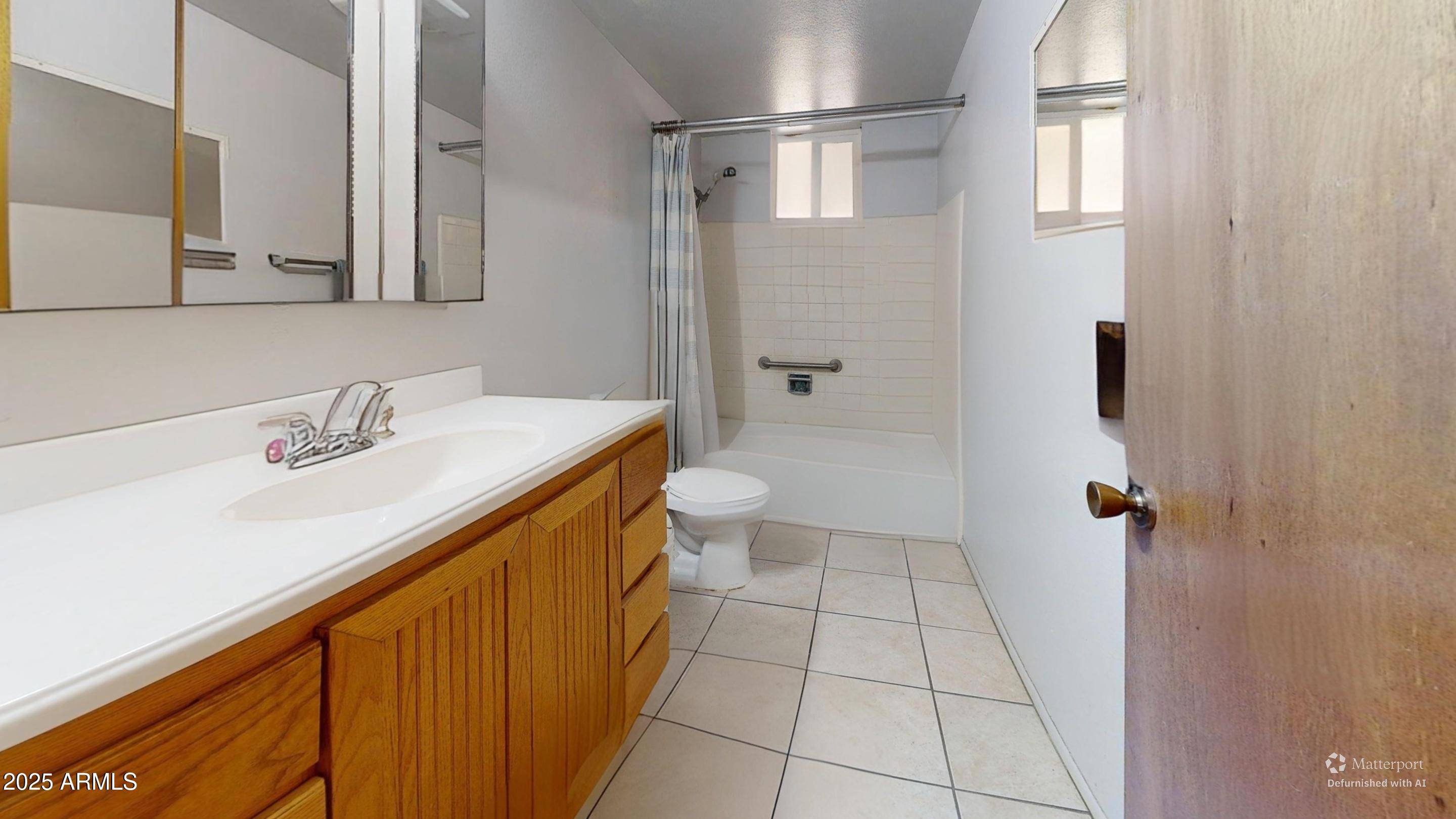 1432 South Lawther Drive Apache Junction, AZ 85120 - Photo 27 of 29 a bathroom with a sink a toilet and shower