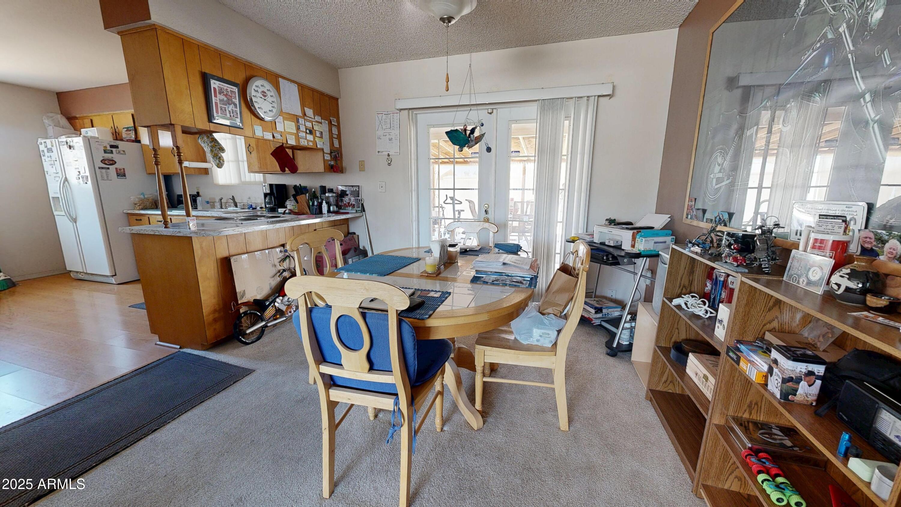 1432 South Lawther Drive Apache Junction, AZ 85120 - Photo 4 of 29 a dining room with furniture and a window