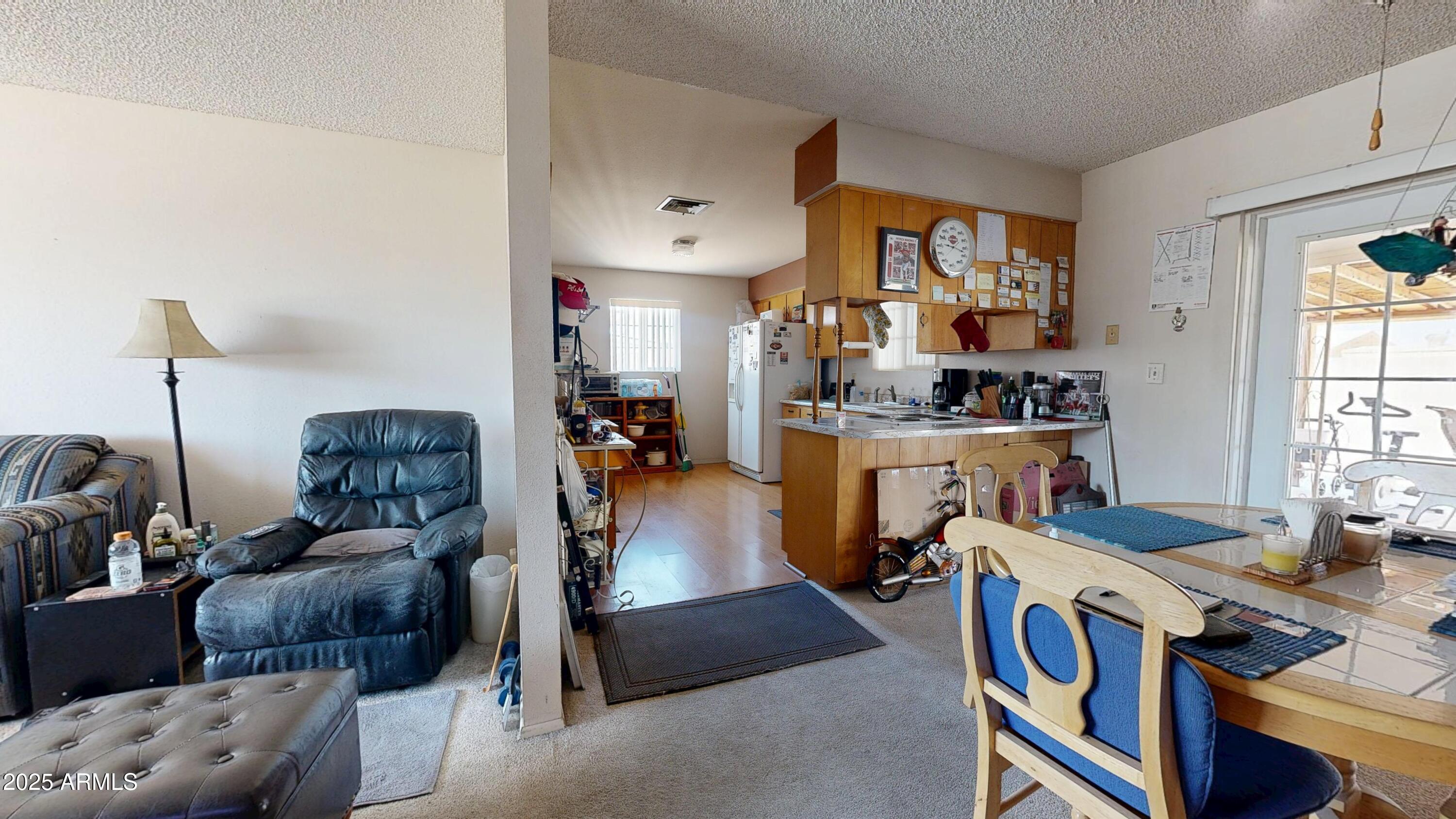 1432 South Lawther Drive Apache Junction, AZ 85120 - Photo 5 of 29 a view of living room kitchen and a window