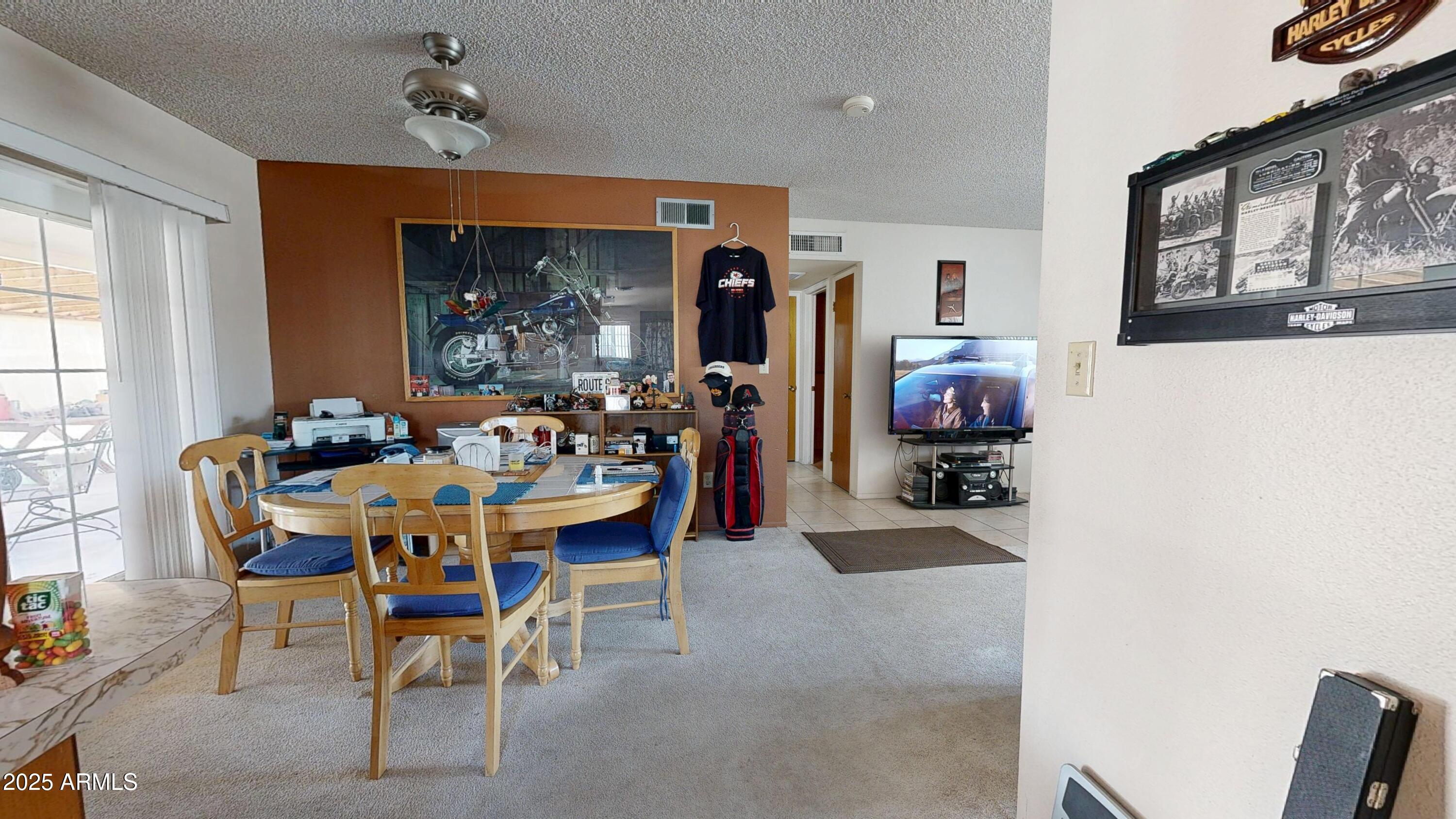 1432 South Lawther Drive Apache Junction, AZ 85120 - Photo 6 of 29 a view of a dining room with furniture and a window