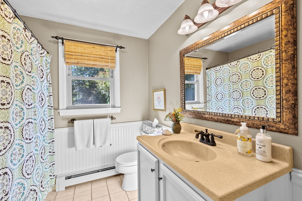 150 Ryder Road Rochester, MA 02770 - Photo 15 of 42 a bathroom with a granite countertop sink and a mirror