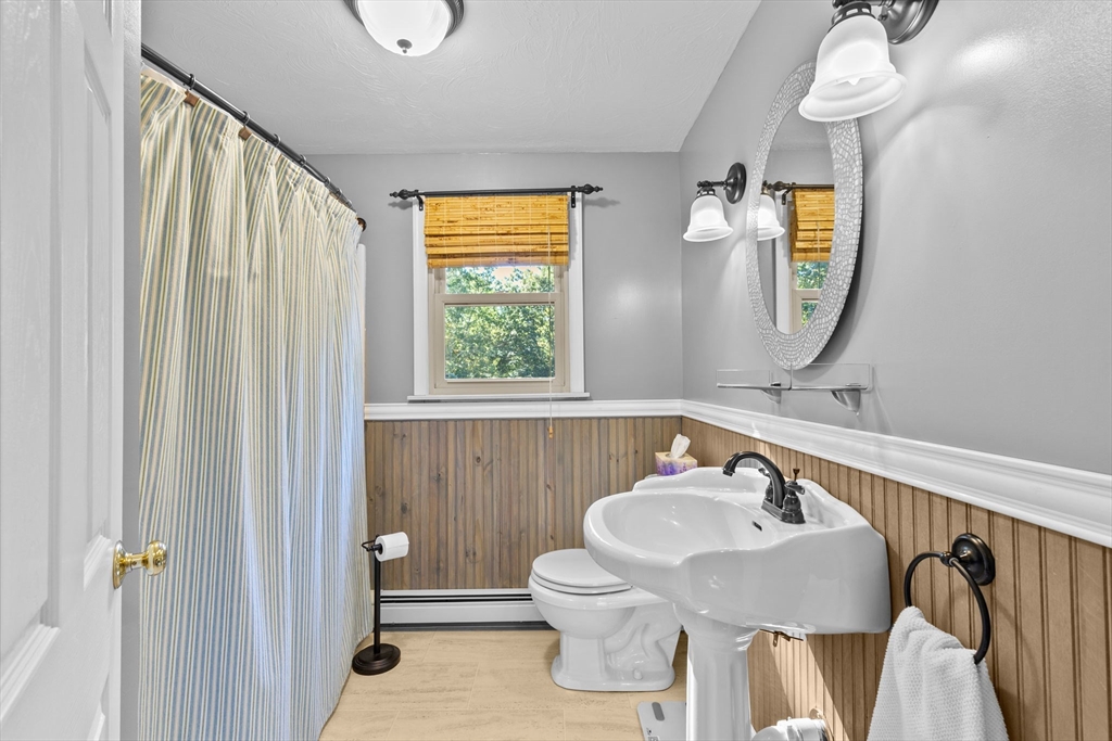 150 Ryder Road Rochester, MA 02770 - Photo 19 of 42 a bathroom with a sink a toilet and a mirror