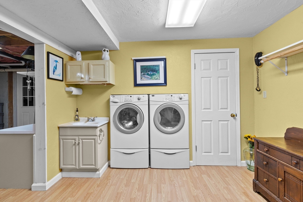 150 Ryder Road Rochester, MA 02770 - Photo 25 of 42 a view of a kitchen with a washer and dryer