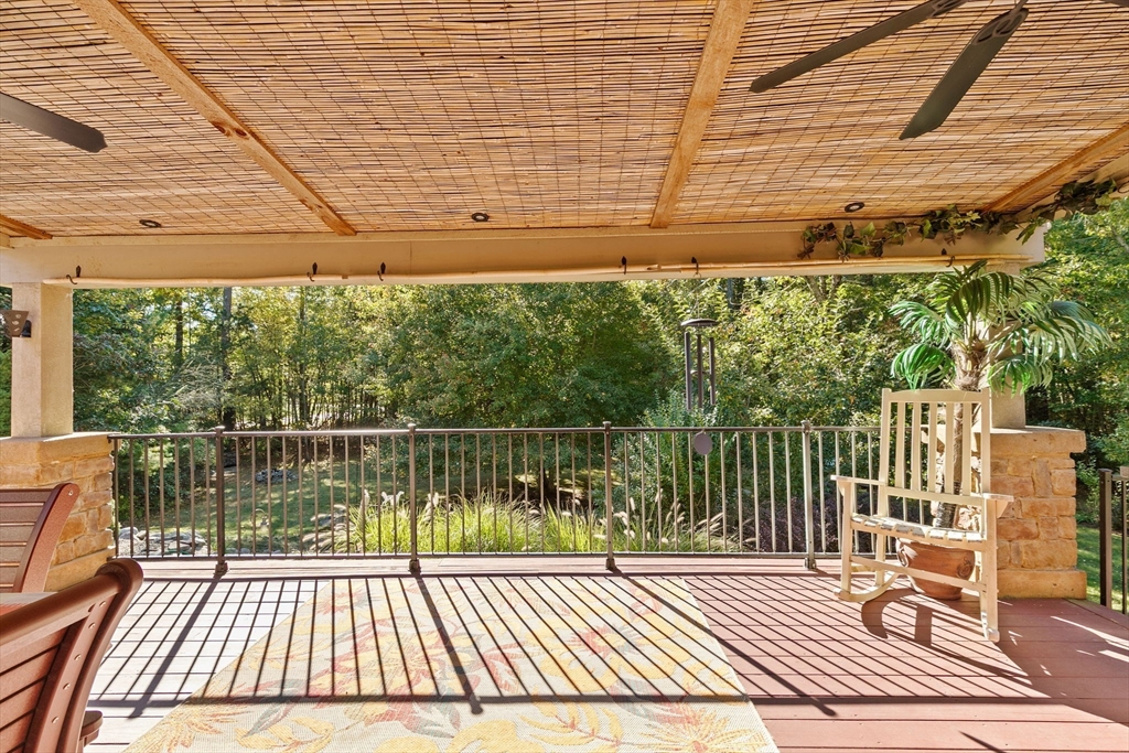 150 Ryder Road Rochester, MA 02770 - Photo 31 of 42 a view of a balcony with wooden floor and fence