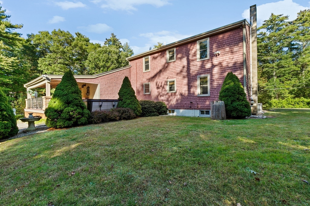150 Ryder Road Rochester, MA 02770 - Photo 33 of 42 a front view of a house with a yard