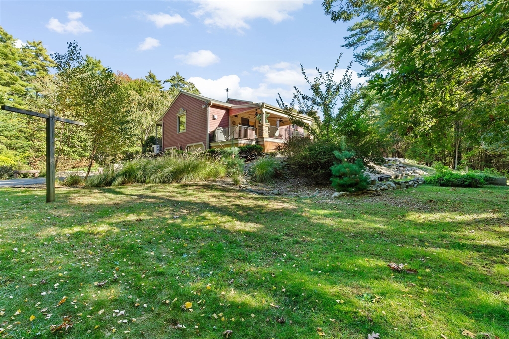 150 Ryder Road Rochester, MA 02770 - Photo 41 of 42 a front view of a house with garden
