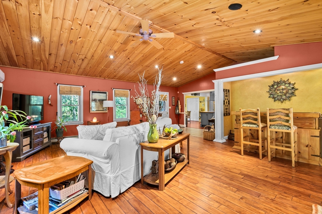 150 Ryder Road Rochester, MA 02770 - Photo 5 of 42 a living room with furniture a wooden floor and next to a window