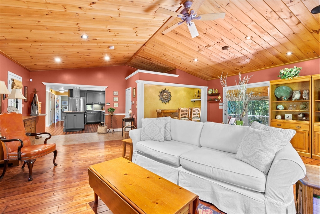 150 Ryder Road Rochester, MA 02770 - Photo 7 of 42 a living room with furniture a wooden floor and next to a window