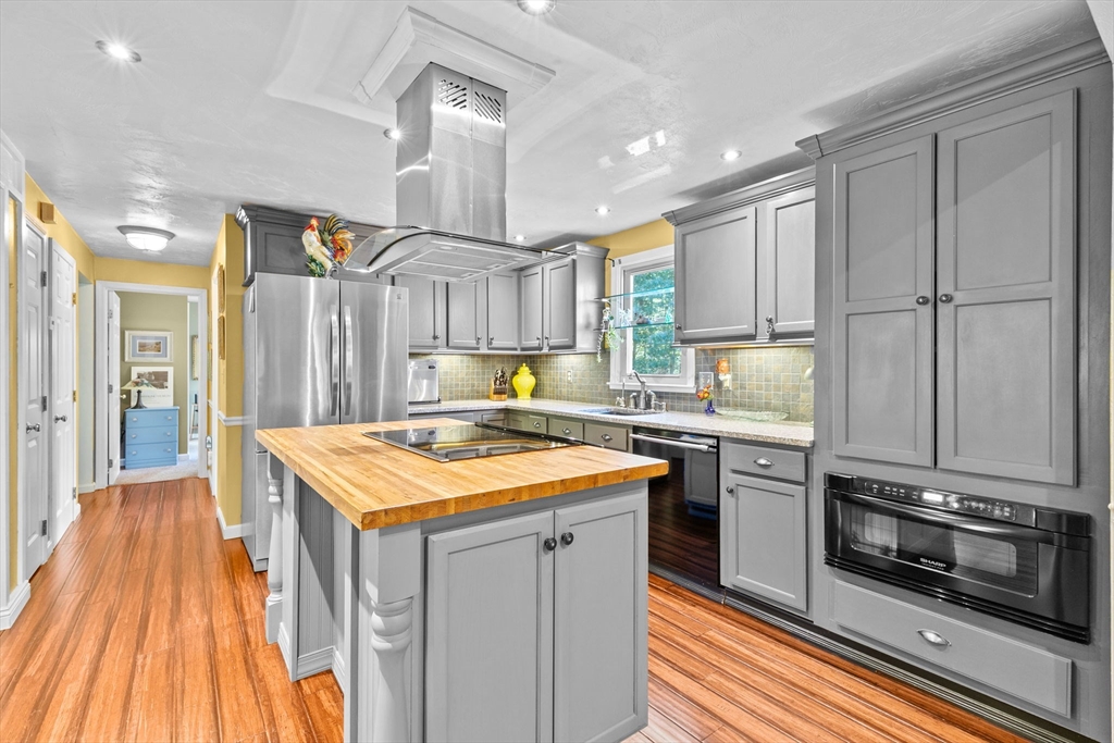 150 Ryder Road Rochester, MA 02770 - Photo 9 of 42 a kitchen with stainless steel appliances granite countertop a sink stove and refrigerator