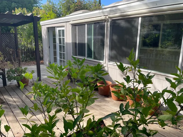 a flower pot with a table and chairs