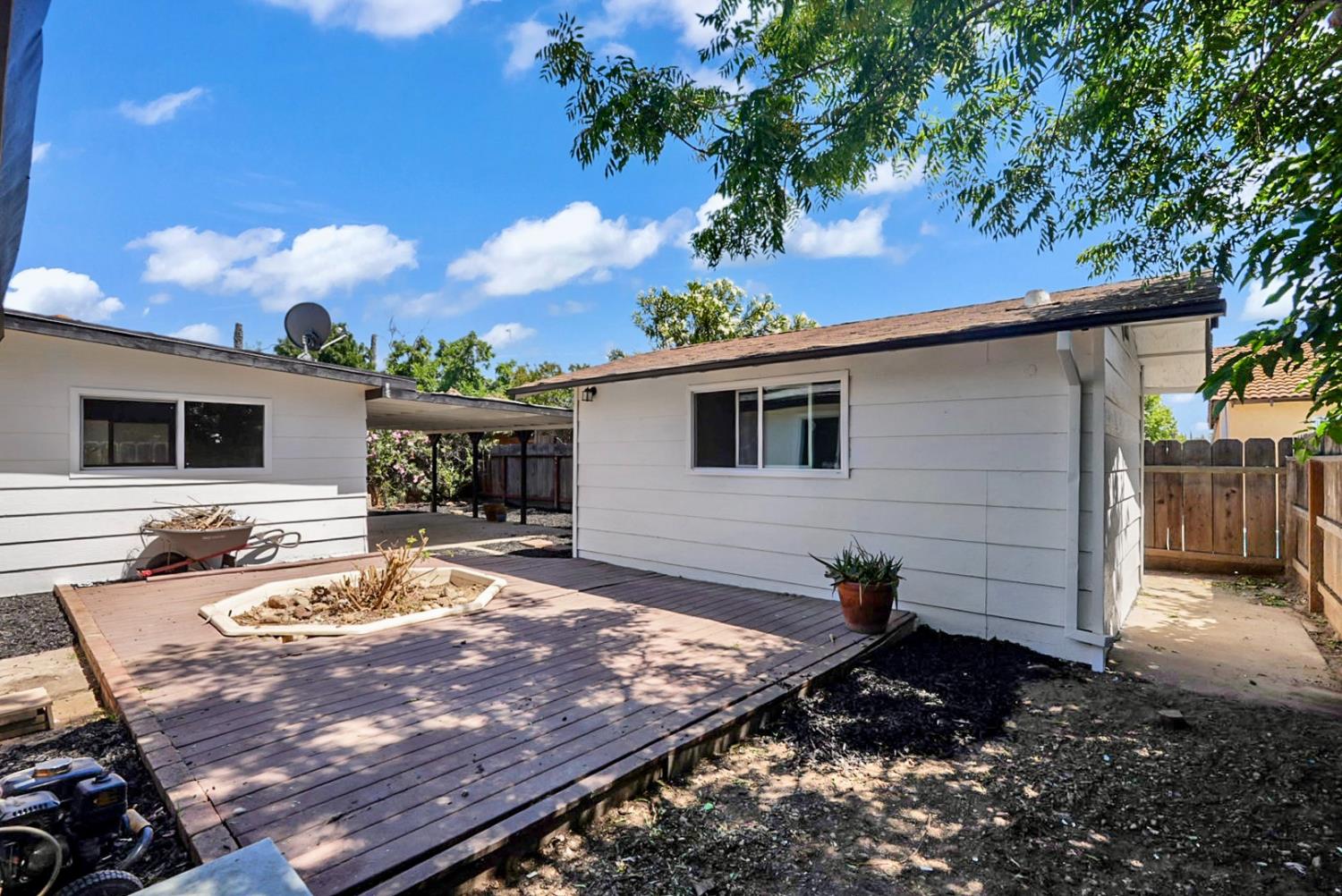 2832 Fowler Road Ceres, CA 95307 - Photo 18 of 28 a view of a backyard with plants and a patio