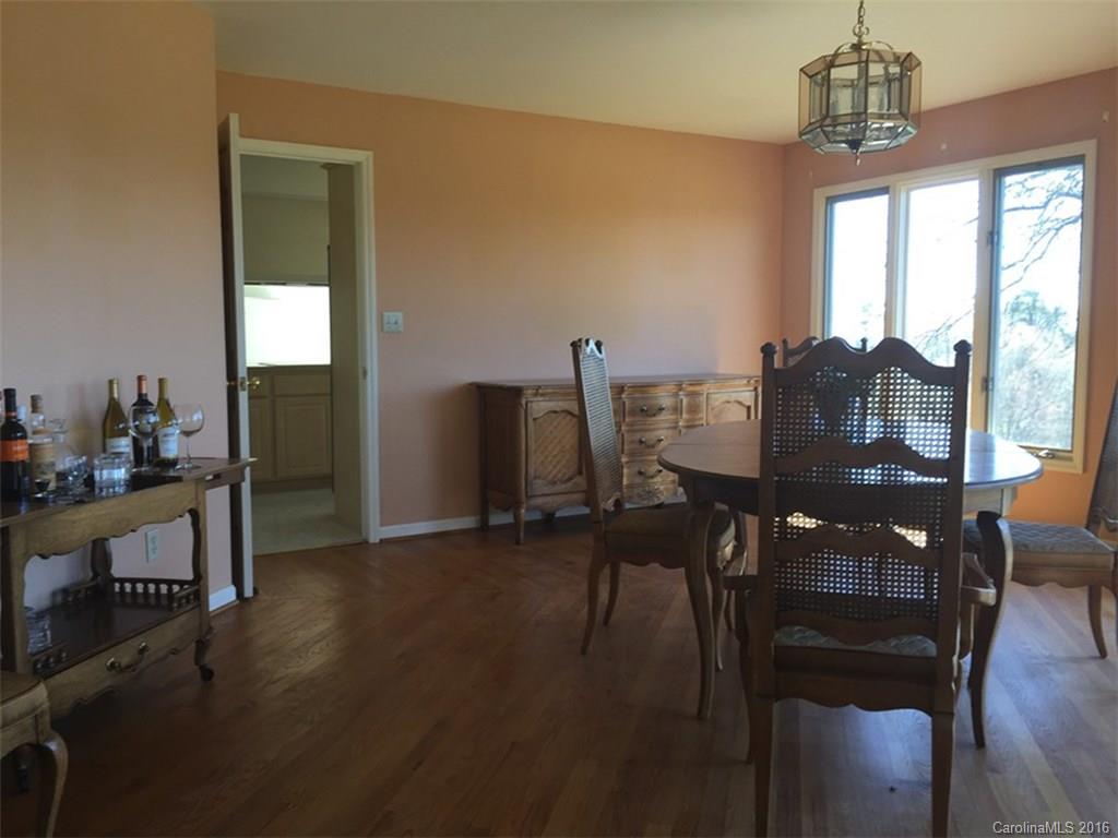 156 Luther Durham Road Tryon, NC 28782 - Photo 15 of 23 a view of a dining room with furniture window and outside view