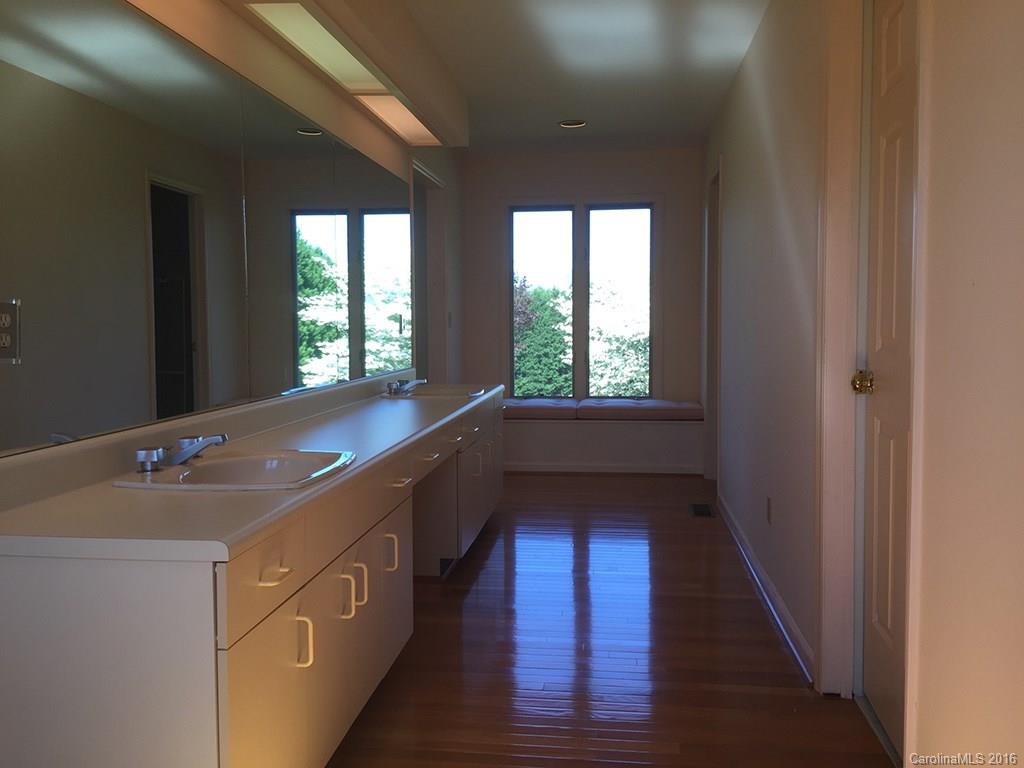 156 Luther Durham Road Tryon, NC 28782 - Photo 17 of 23 a kitchen with a sink and windows