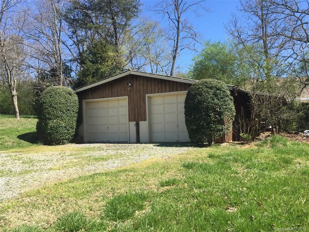 156 Luther Durham Road Tryon, NC 28782 - Photo 21 of 23 a front view of a house with a yard