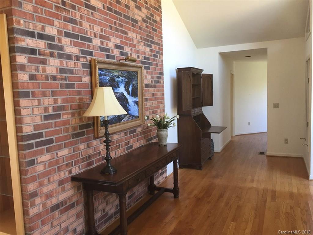 156 Luther Durham Road Tryon, NC 28782 - Photo 5 of 23 a living room with furniture and wooden floor