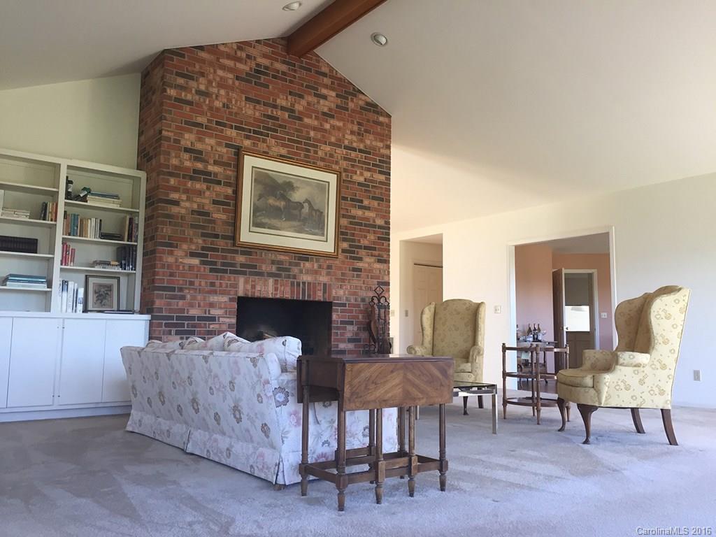 156 Luther Durham Road Tryon, NC 28782 - Photo 6 of 23 a living room with furniture and a fireplace