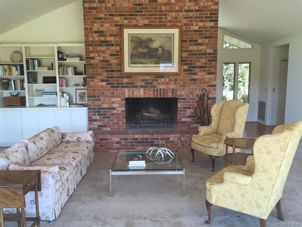 156 Luther Durham Road Tryon, NC 28782 - Photo 7 of 23 a living room with furniture and a fireplace