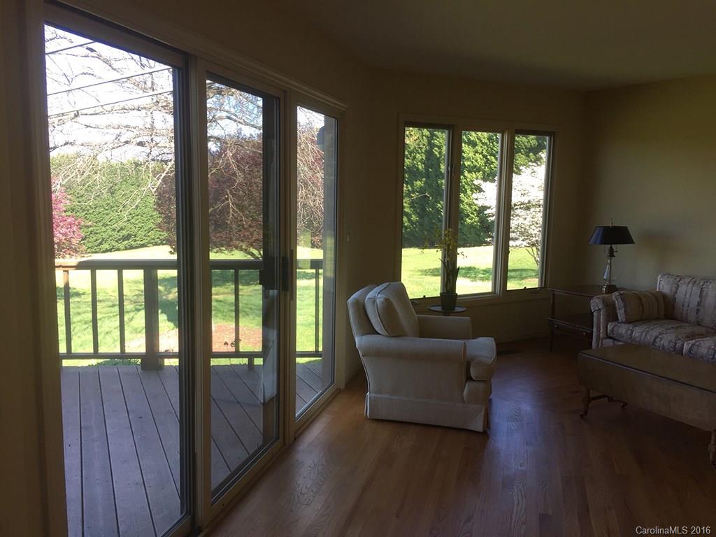 156 Luther Durham Road Tryon, NC 28782 - Photo 9 of 23 a living room with furniture and a large window