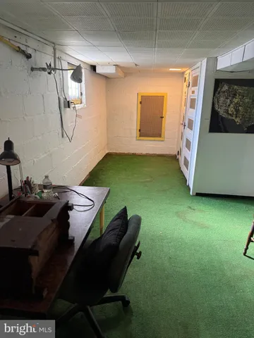 a workspace with furniture and window