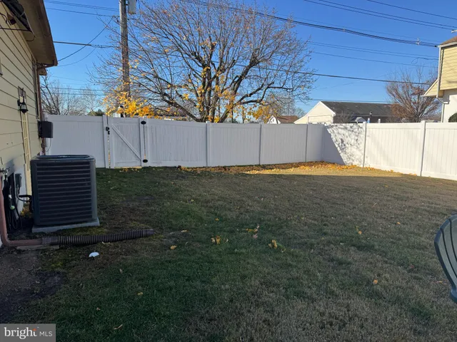 a black car parked in front of house