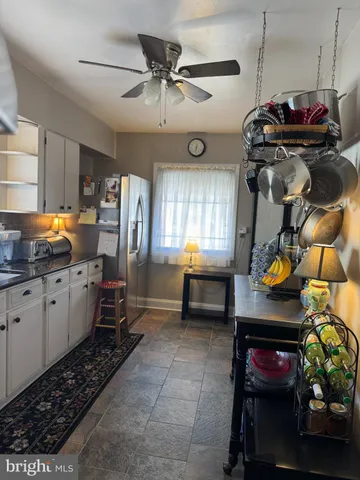 a kitchen with refrigerator and window