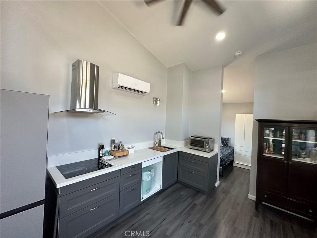 626 Broadway Gilroy, CA 95020 - Photo 3 of 5 a kitchen with granite countertop a sink and cabinets