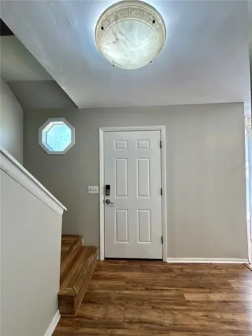 a view of a livingroom with wooden floor
