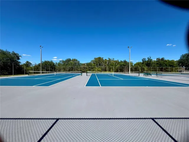 a view of a sign board with wooden fence