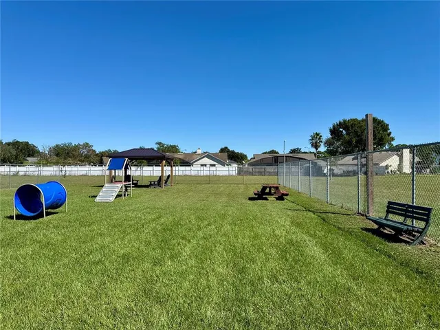 a view of a golf course with chairs