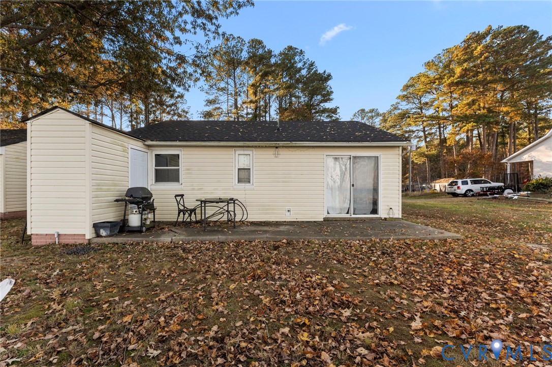 63 Bayview Lane Hague, VA 22469 - Photo 8 of 23 a backyard of a house with large trees