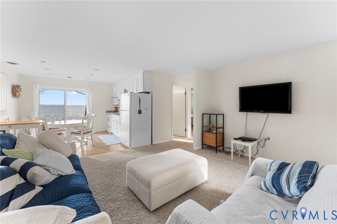 63 Bayview Lane Hague, VA 22469 - Photo 10 of 23 a living room with furniture and a flat screen tv