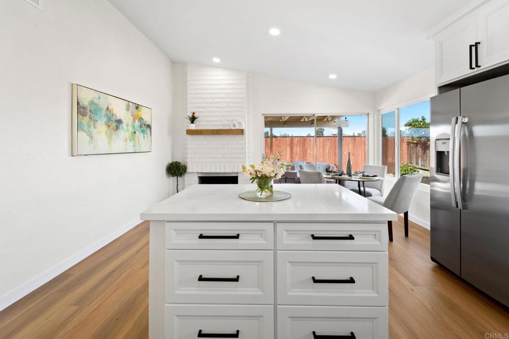 5055 Andrew Jackson Street Oceanside, CA 92057 - Photo 14 of 43 a kitchen with a refrigerator and white cabinets