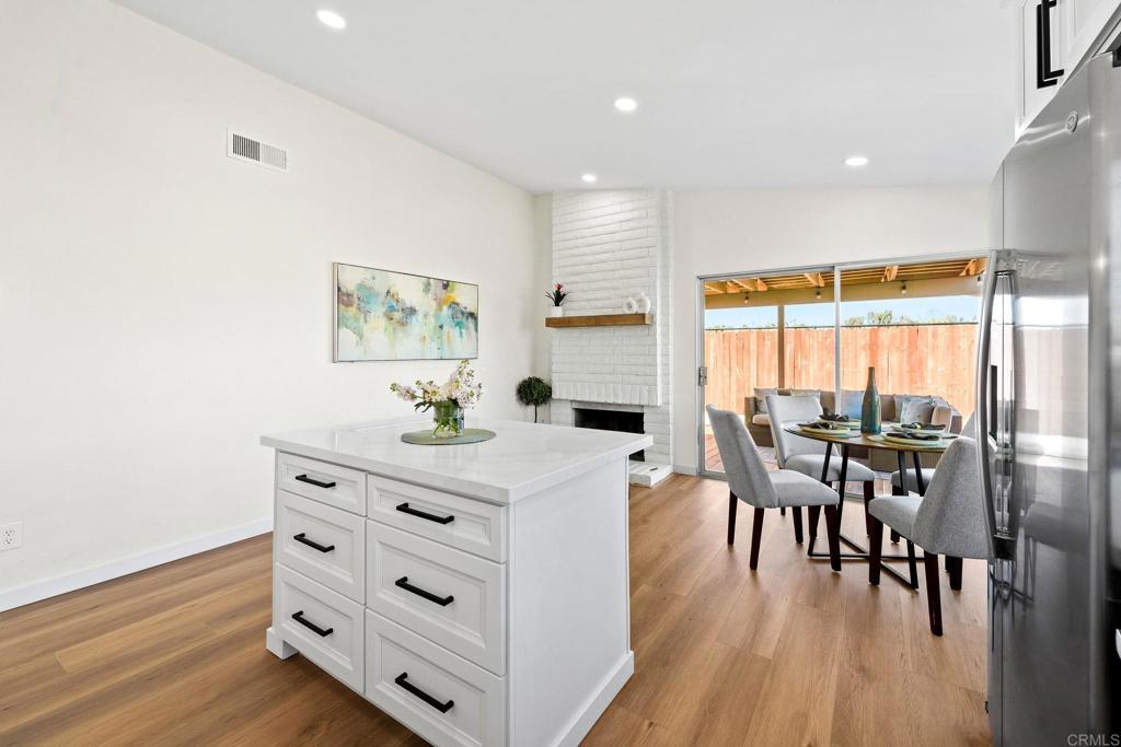 5055 Andrew Jackson Street Oceanside, CA 92057 - Photo 15 of 43 a view of a dining room with furniture window and wooden floor