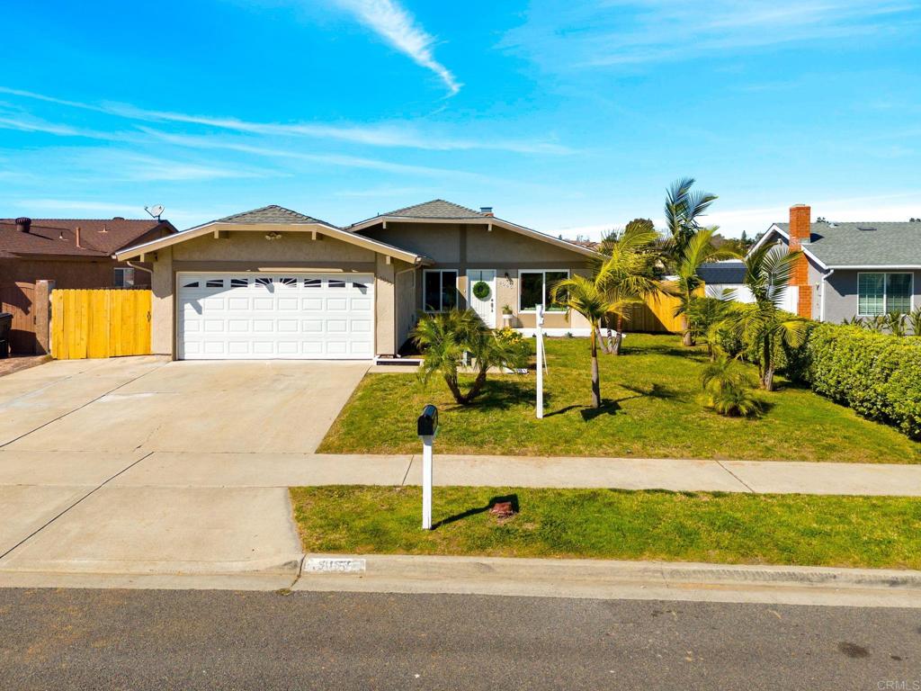 5055 Andrew Jackson Street Oceanside, CA 92057 - Photo 2 of 43 a front view of a house with a yard