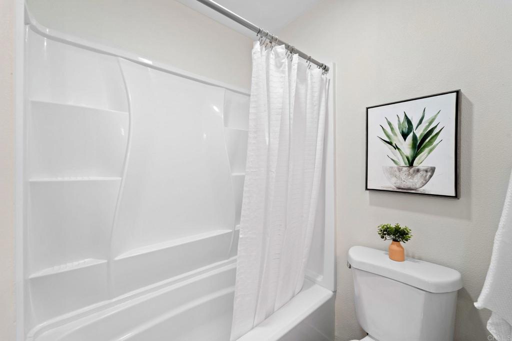 5055 Andrew Jackson Street Oceanside, CA 92057 - Photo 24 of 43 a white toilet sitting next to a bath tub